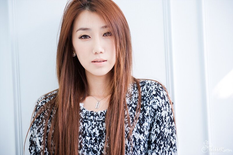 Woman with Long Brown Hair — Neutral, Photograph, Necklace, Earring, Knit Sweater
