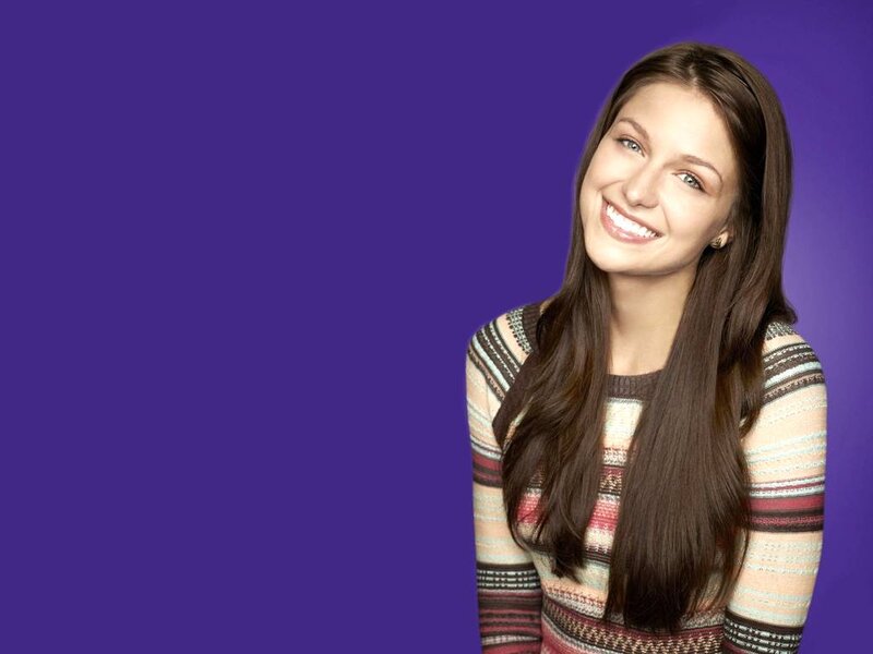 Woman with Long Brown Hair — Purple, Smiling