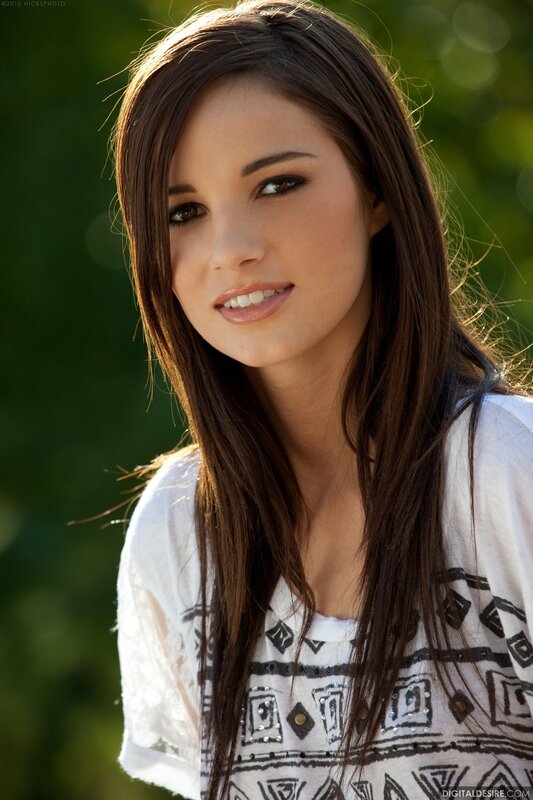 Woman with Long Brown Hair — Serene, Afternoon, Photograph, White Shirt, Green Background
