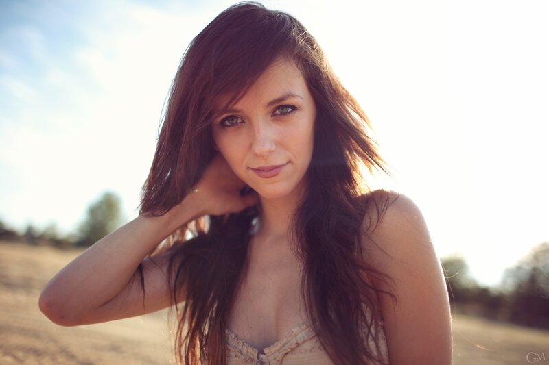 Woman with Long Brown Hair — Serene, Sunset, Photograph, Sunlight