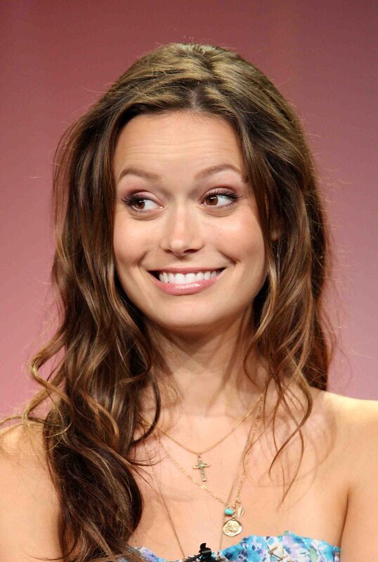 woman with long brown hair smiling