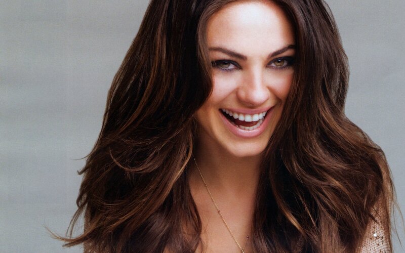 woman with long brown hair smiling
