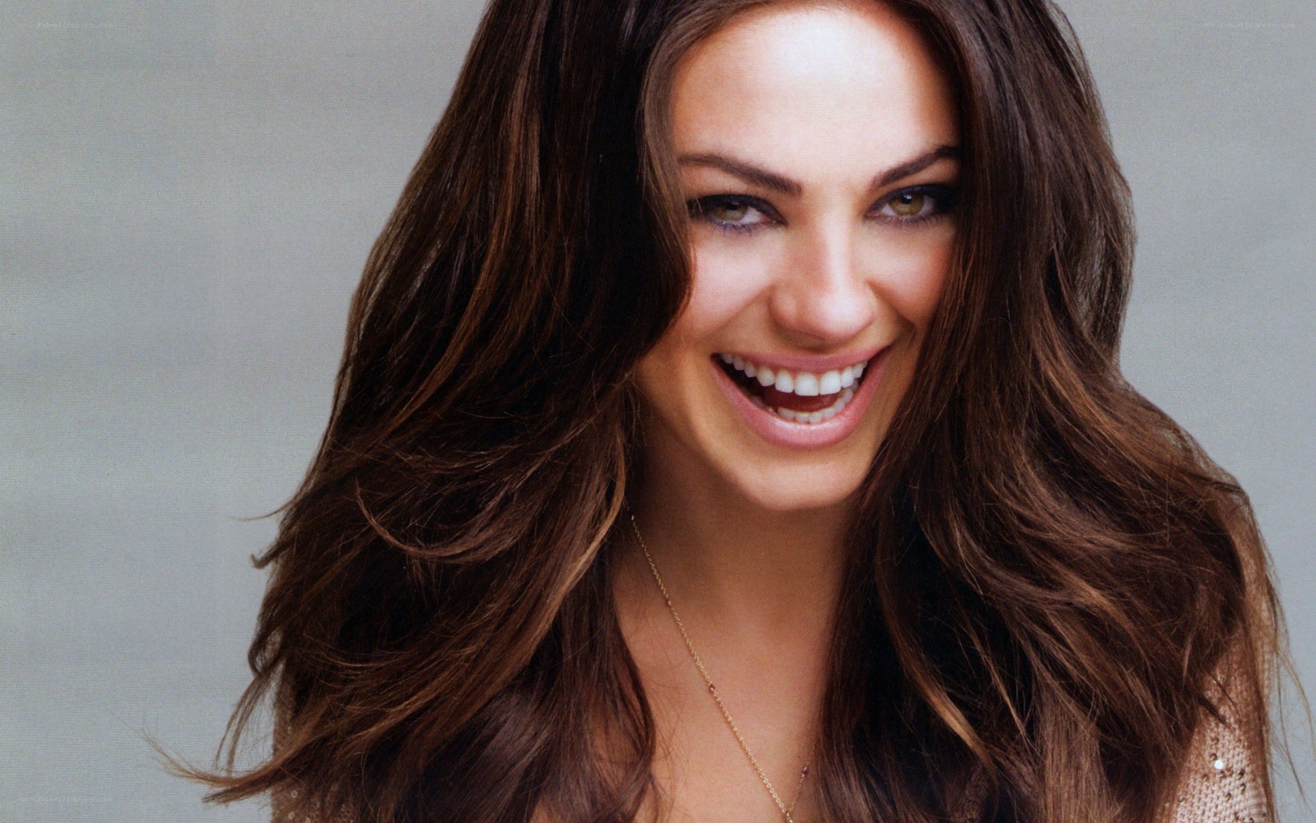 woman with long brown hair smiling