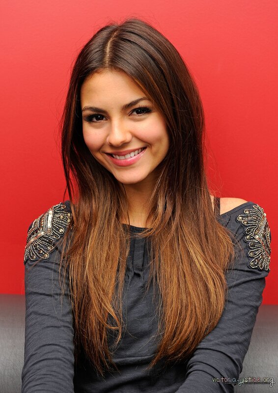 woman with long brown hair smiling