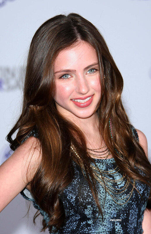 woman with long brown hair smiling