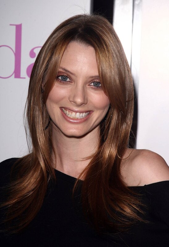 woman with long brown hair smiling