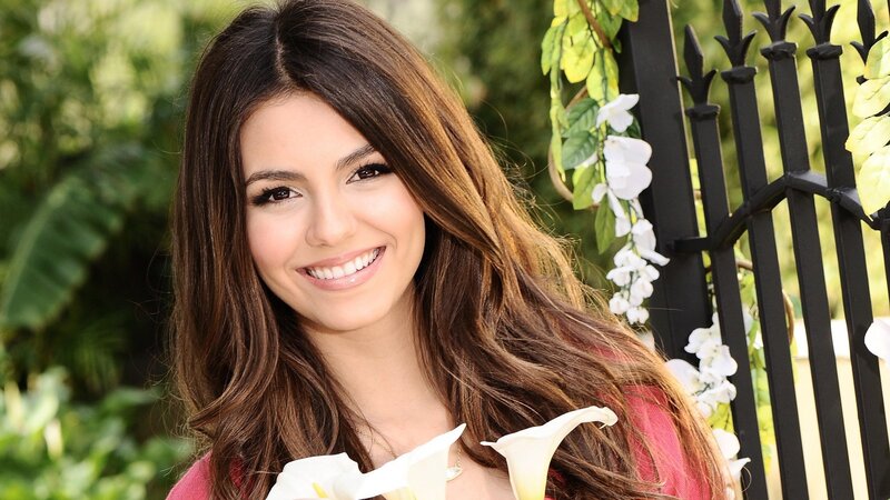 woman with long brown hair smiling