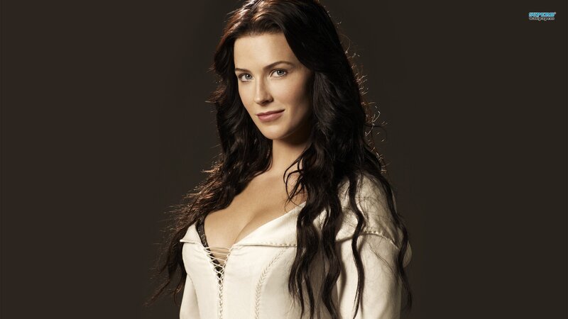 Woman with Long Dark Hair — Black, Neutral, Photograph, White Top, Dark Background