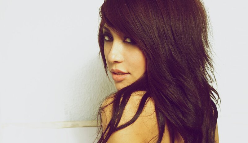 Woman with Long Dark Hair — Brown, Neutral, Photograph, Shoulder, Wall