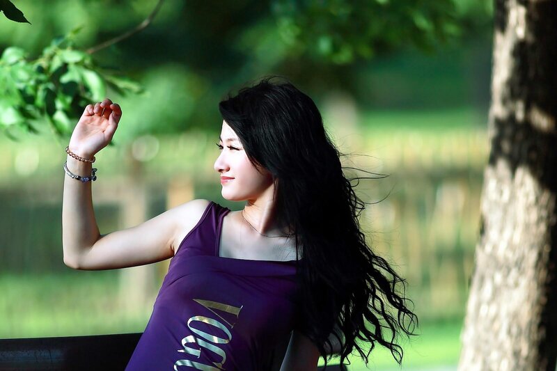 Woman with Long Dark Hair — Purple, Serene, Afternoon
