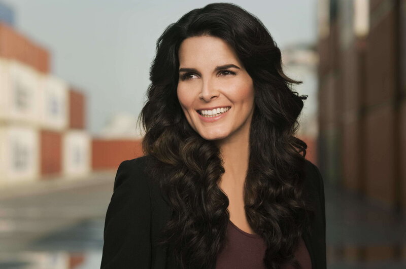 woman with long dark hair smiling