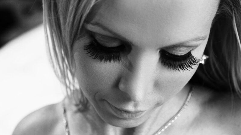Woman with Long Eyelashes — Black, Contemplative