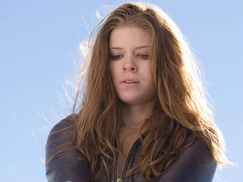 woman with long hair against blue sky