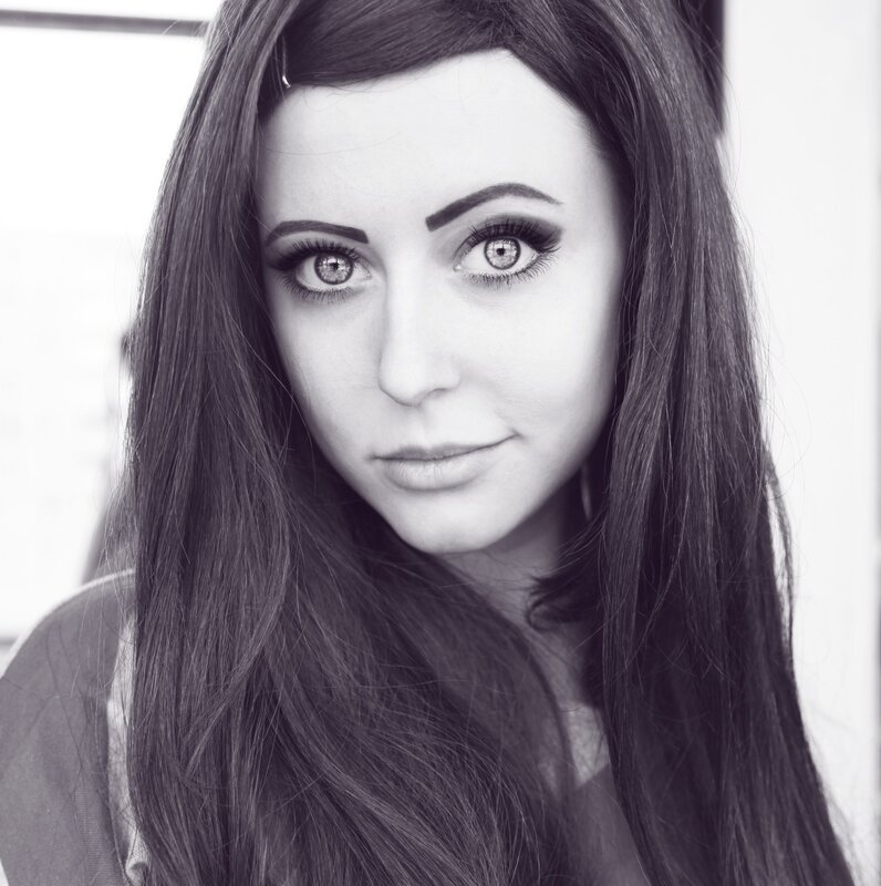woman with long hair and dramatic makeup