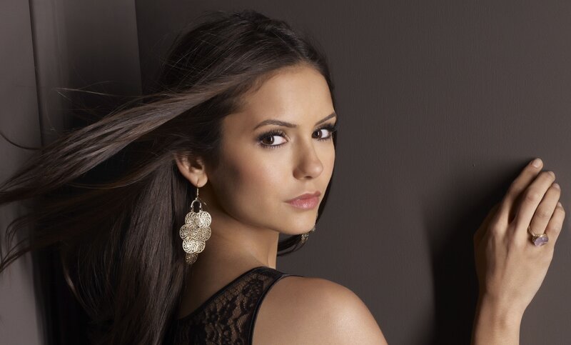 woman with long hair and earrings