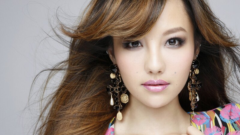 woman with long hair and earrings