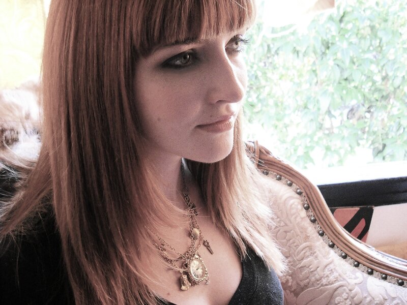 woman with long hair and necklace