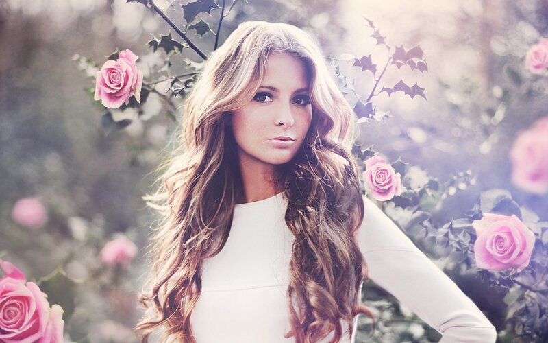 woman with long hair and roses
