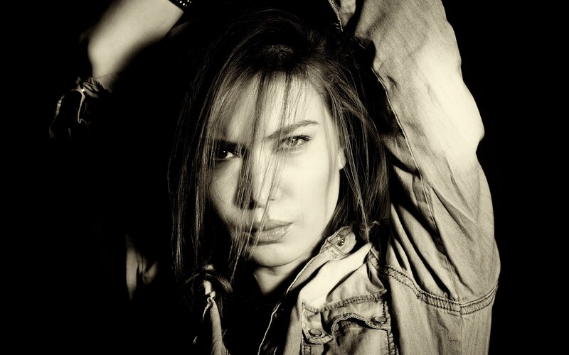 Woman with Long Hair — Black, Dramatic, Photograph, Jacket, Arms