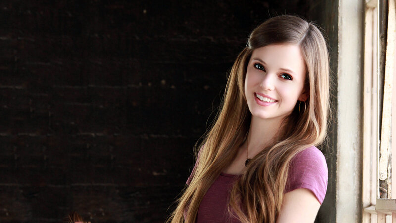 Woman with Long Hair — Brown, Calm, Photograph, Brick Wall