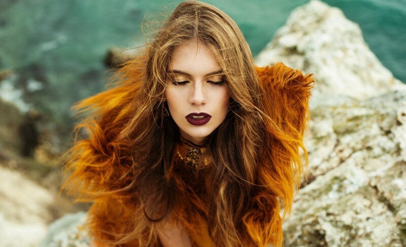 Woman with Long Hair — Brown, Dramatic, Photograph, Rocks