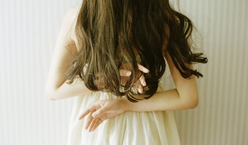 woman with long hair from behind