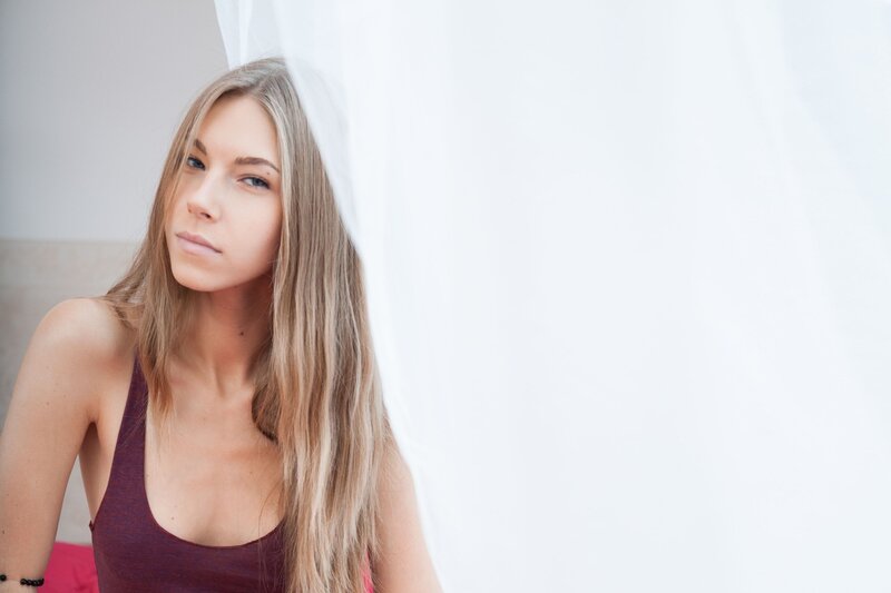 woman with long hair in a tank top
