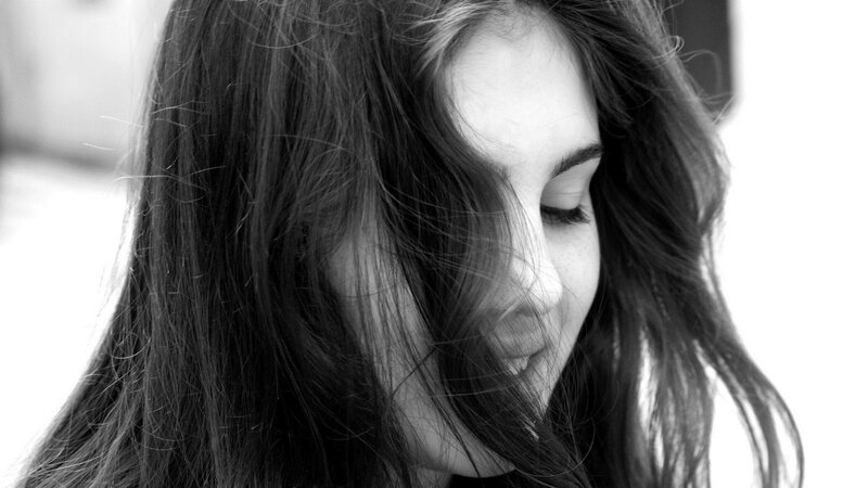 woman with long hair in black and white