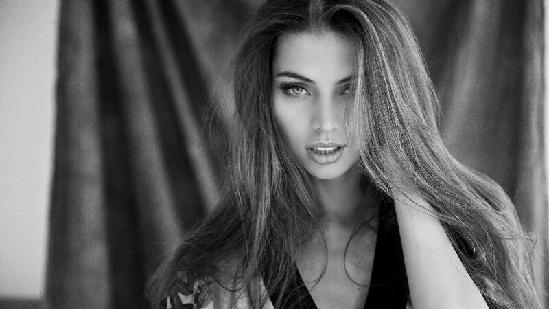 woman with long hair in black and white