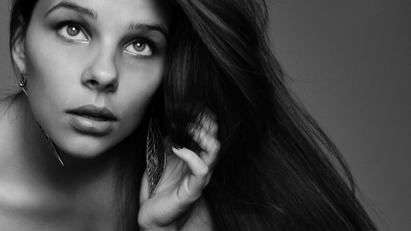woman with long hair in black and white