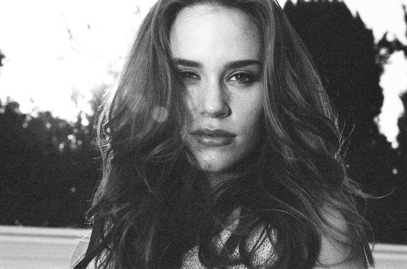 woman with long hair in black and white