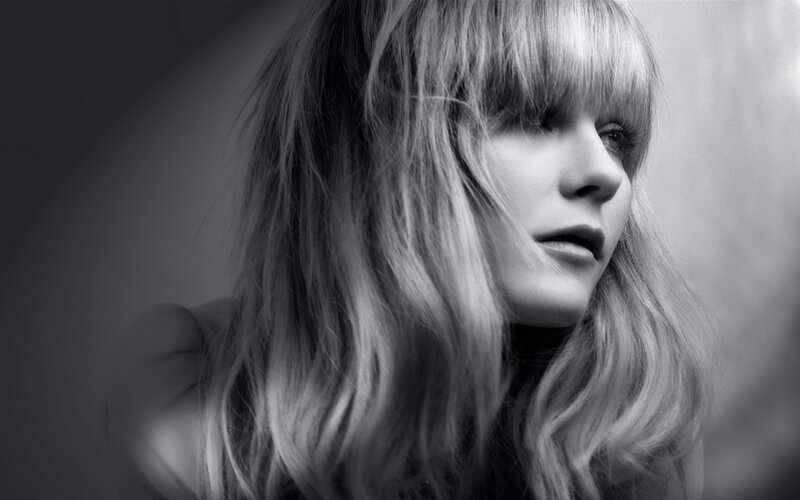 woman with long hair in black and white