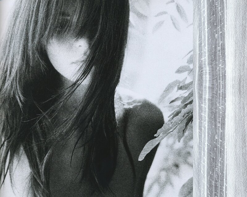 woman with long hair in black and white
