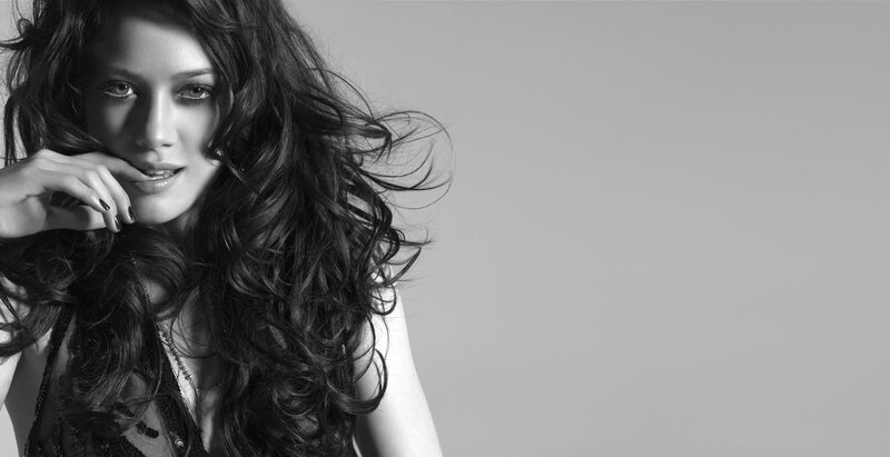 woman with long hair in black and white