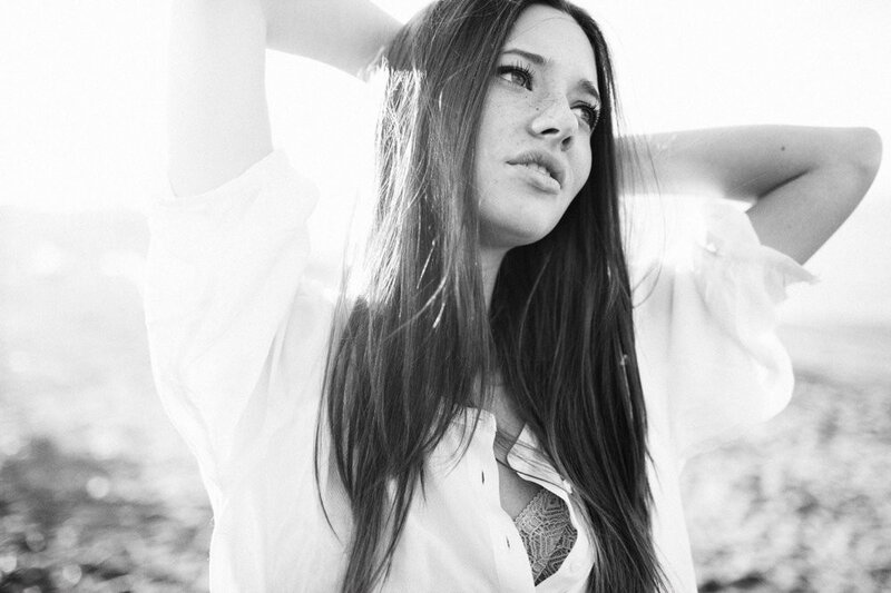 woman with long hair in black and white