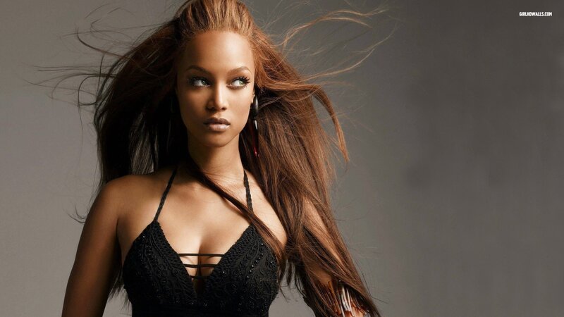 woman with long hair in black top
