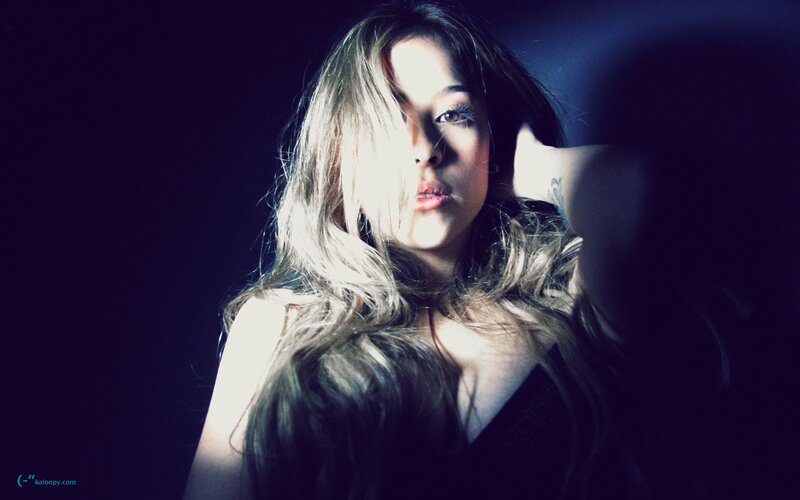 woman with long hair in dark room