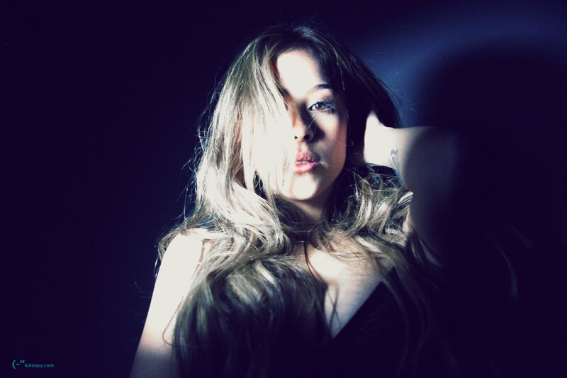 woman with long hair in dark room