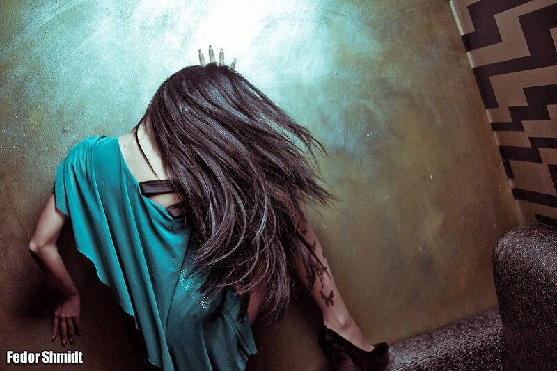 woman with long hair in dark room