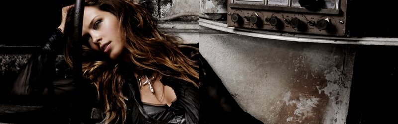 woman with long hair in dark setting