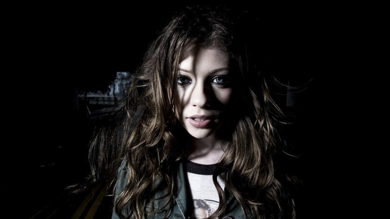woman with long hair in dark setting