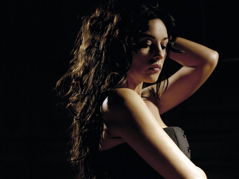 woman with long hair in dark setting