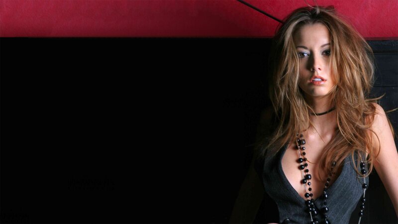 woman with long hair in dark setting