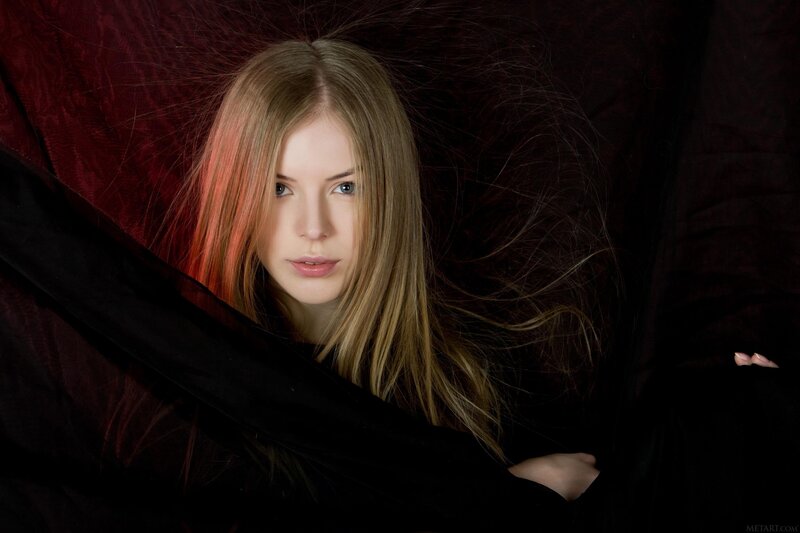 woman with long hair in dark setting