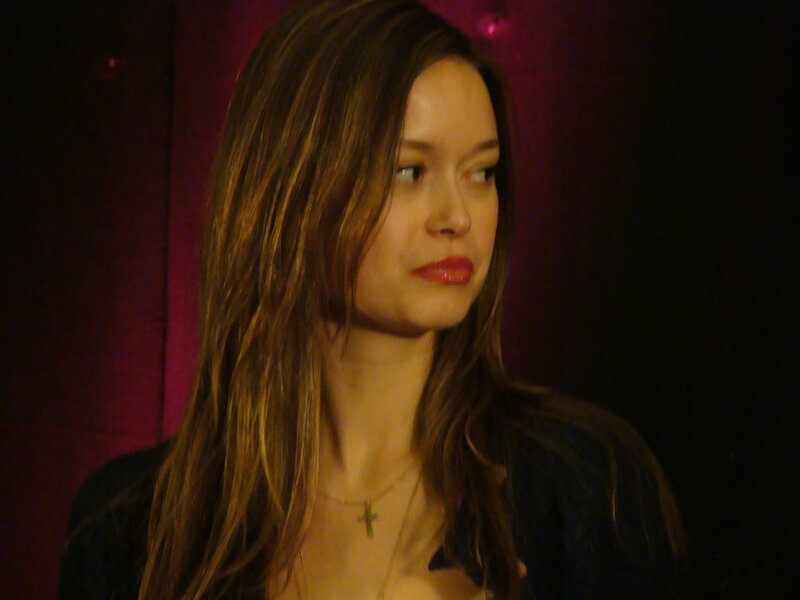 woman with long hair in dim light