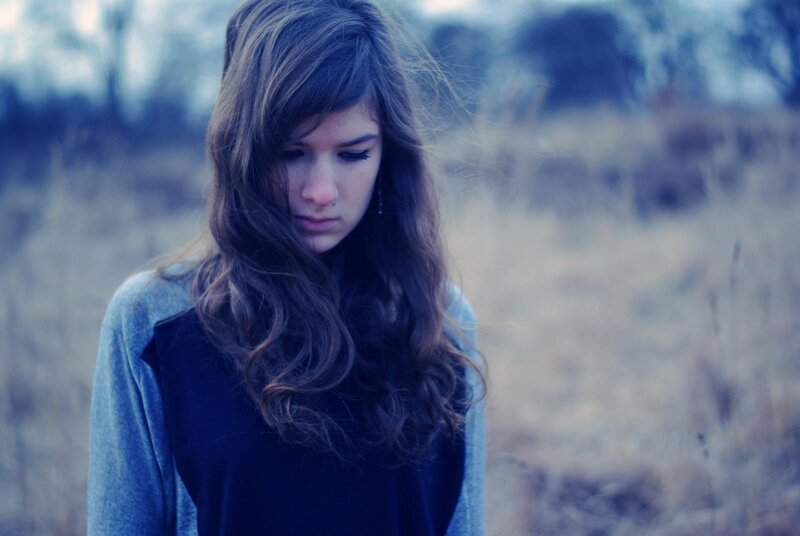 woman with long hair in field