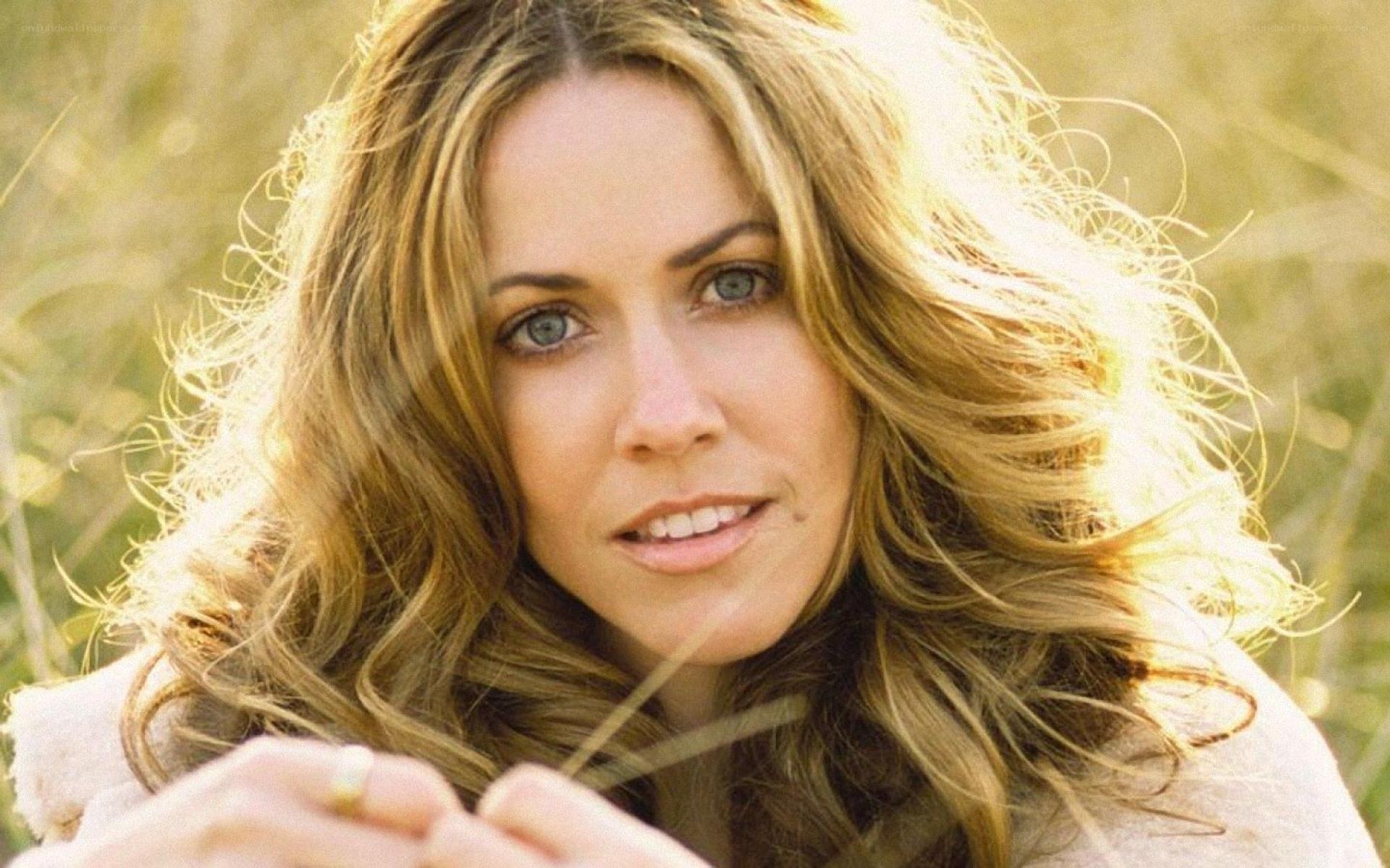woman with long hair in field