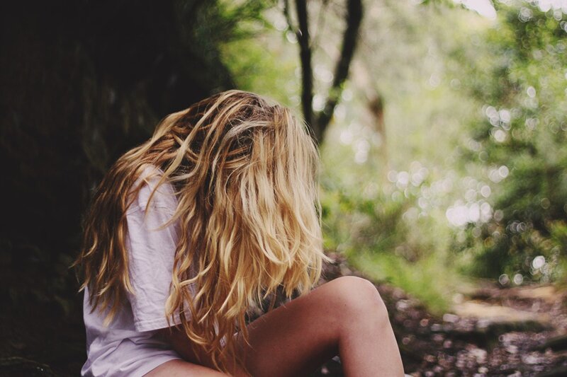 woman with long hair in forest
