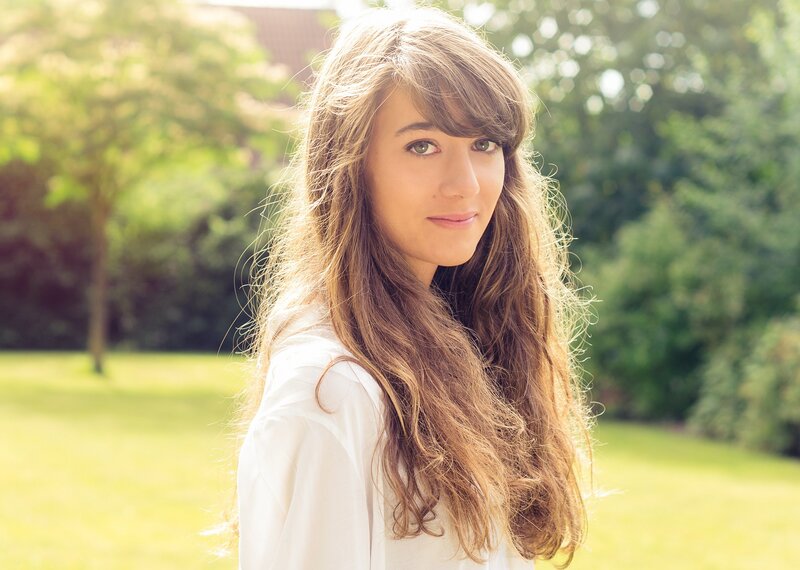 woman with long hair in garden