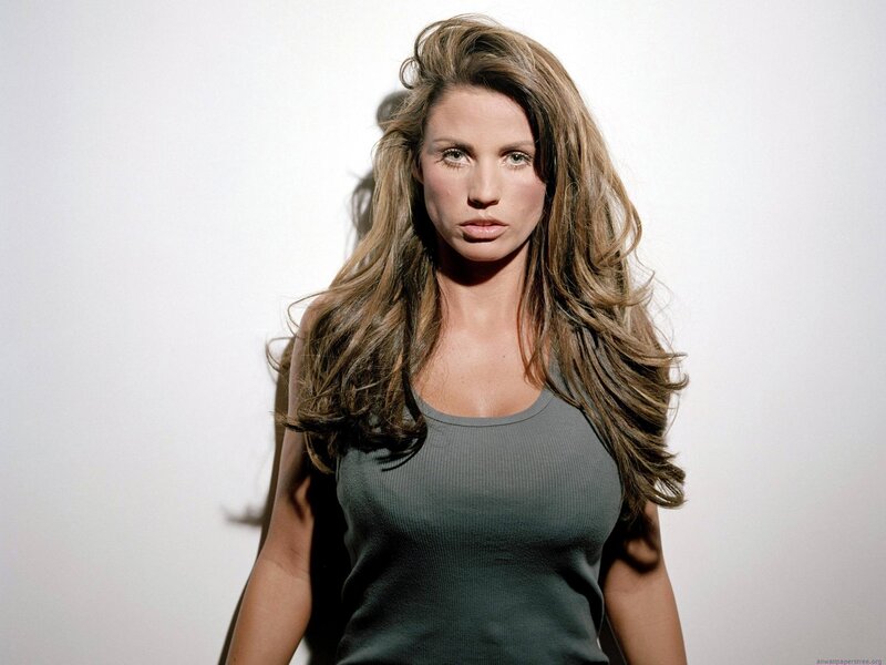 woman with long hair in gray tank top